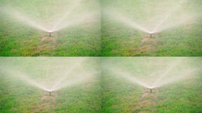可收放式洒水器在浇灌草坪时由小水滴产生雾气