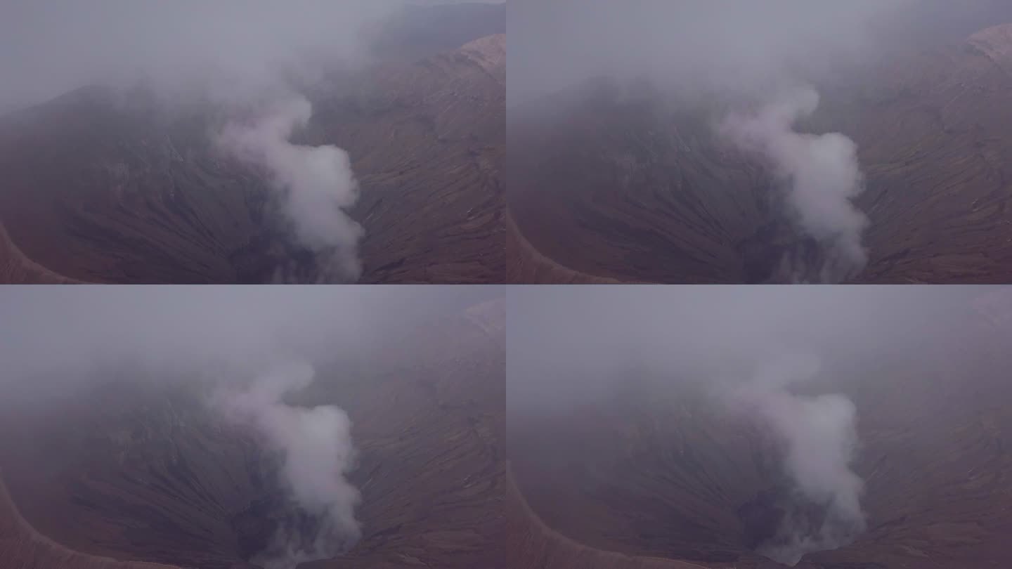 无人机鸟瞰图:布罗莫火山火山口边缘与蒸汽，亚洲。旅游目的地探险自然的概念