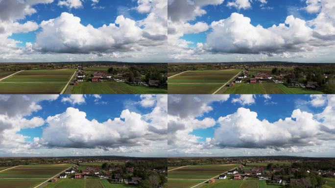 无人机在乡村风景晴朗的天空拍摄蓬松的云