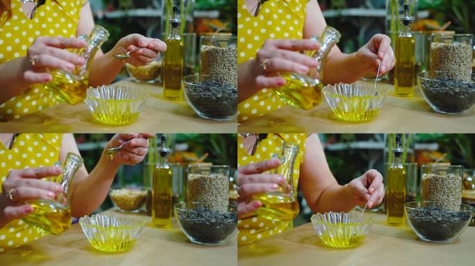 (特写)葵花籽油从玻璃瓶里倒进盘子里。一位营养学家评估天然葵花籽油的味道和气味。向日葵产品的背景。