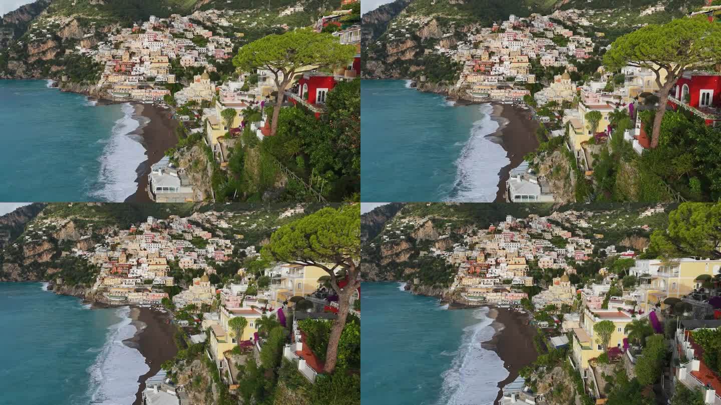 意大利波西塔诺村，在色彩缤纷的房屋、教堂和绿松石般的海滩上空飞行。著名的旅游胜地阿马尔菲海岸-波西塔