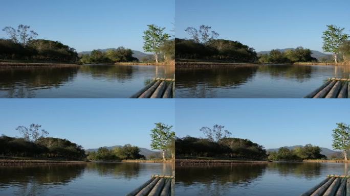 河中竹筏的特写，与山和自然景观