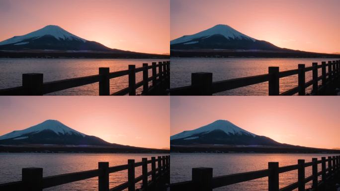 黄昏时分的富士山，落日映照在川口湖上，川口湖是游客和旅行者的地标和目的地。宁静夜晚的自然之美
