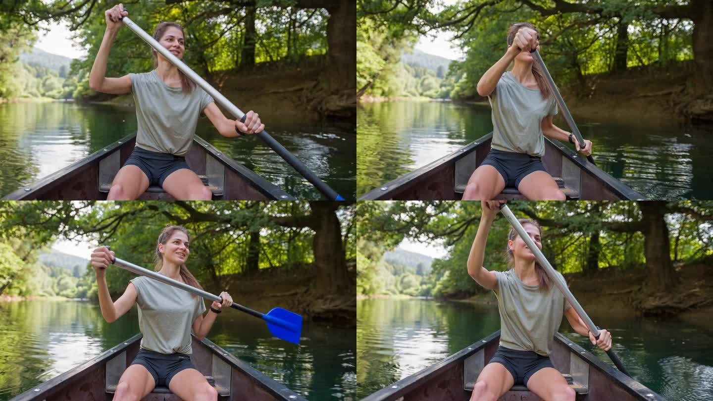 女子在河上划独木舟