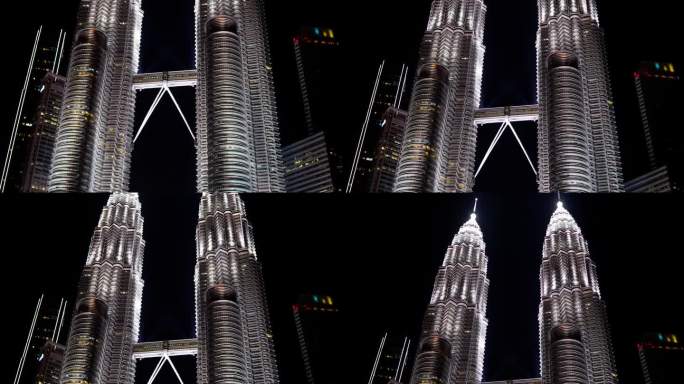 双子塔是马来西亚吉隆坡的重要标志，在夜晚，双子塔周围有美丽的风景。