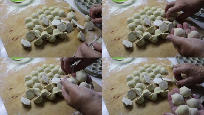 在烹饪用的天然材料木板上切饺子