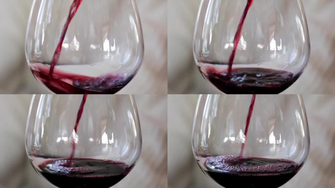 水晶杯中旋转的红酒特写，红酒在杯中旋转，突出了饮料鲜艳的颜色和流畅的运动。