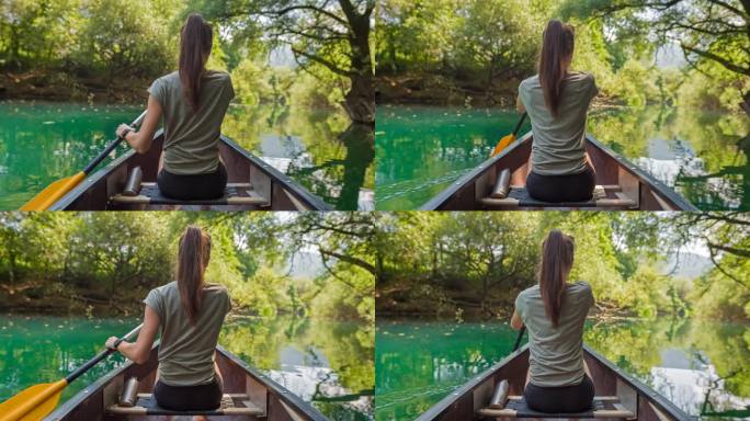活跃的女子在河上划独木舟，享受自然美景