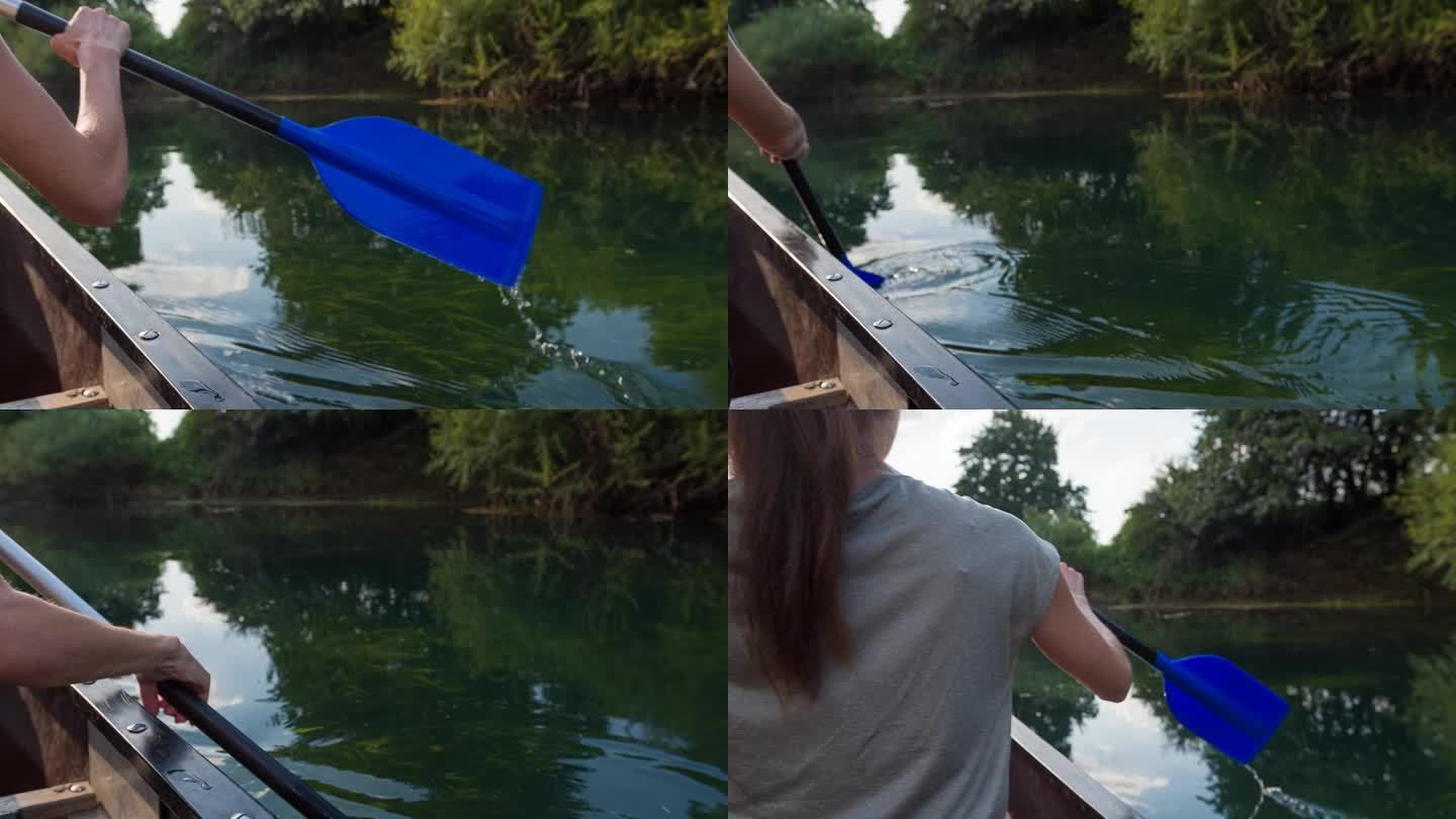 在雄伟的荒野中，一个女人在河上划着独木舟