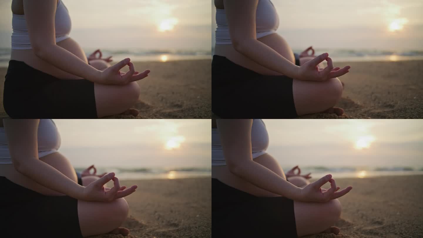 孕妇在沙滩上冥想，手持拍摄