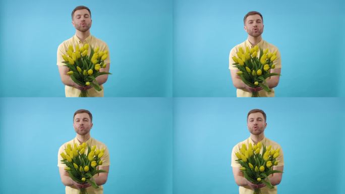 男子手持一束黄花，在蓝色背景上接吻