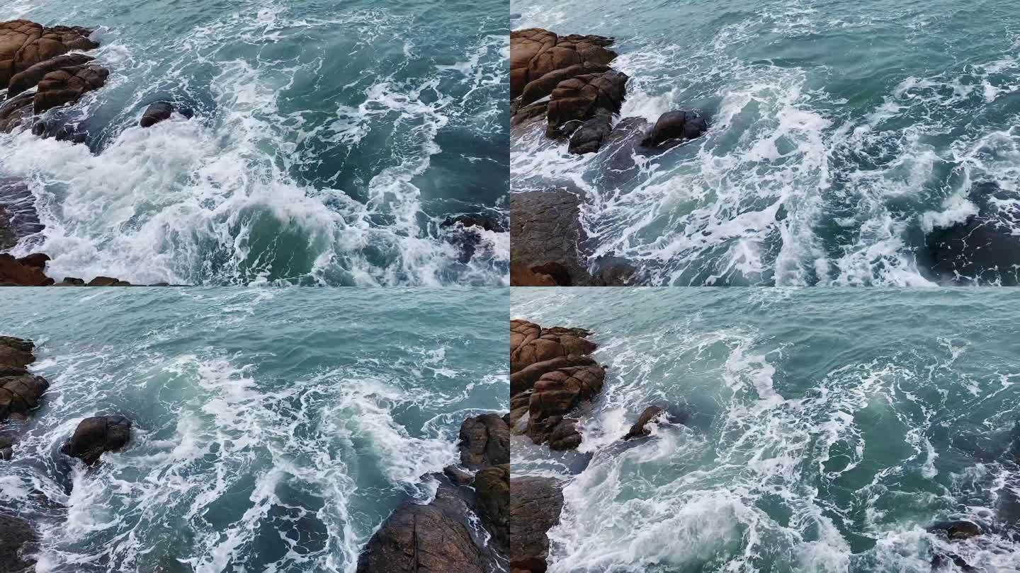 阴天海浪拍打冲击岩石形成浪花