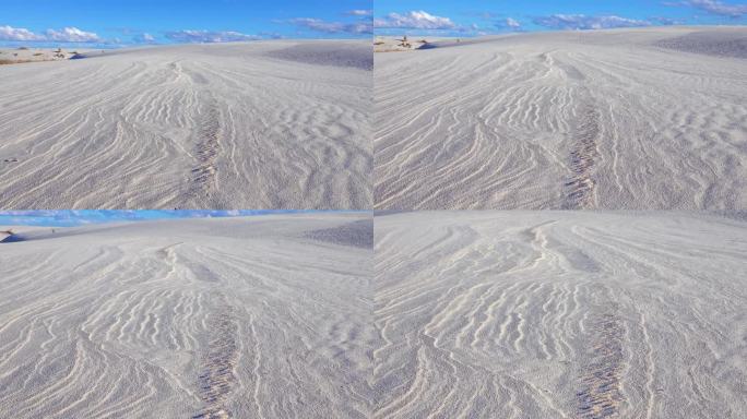 在美国新墨西哥州的白沙国家纪念碑，海浪在白色的石膏沙上
