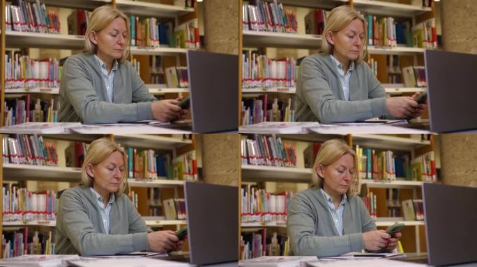 在共享办公室工作的中年女性，在图书馆看书的背景下使用笔记本电脑和智能手机。女成人教师为学校备课、科学