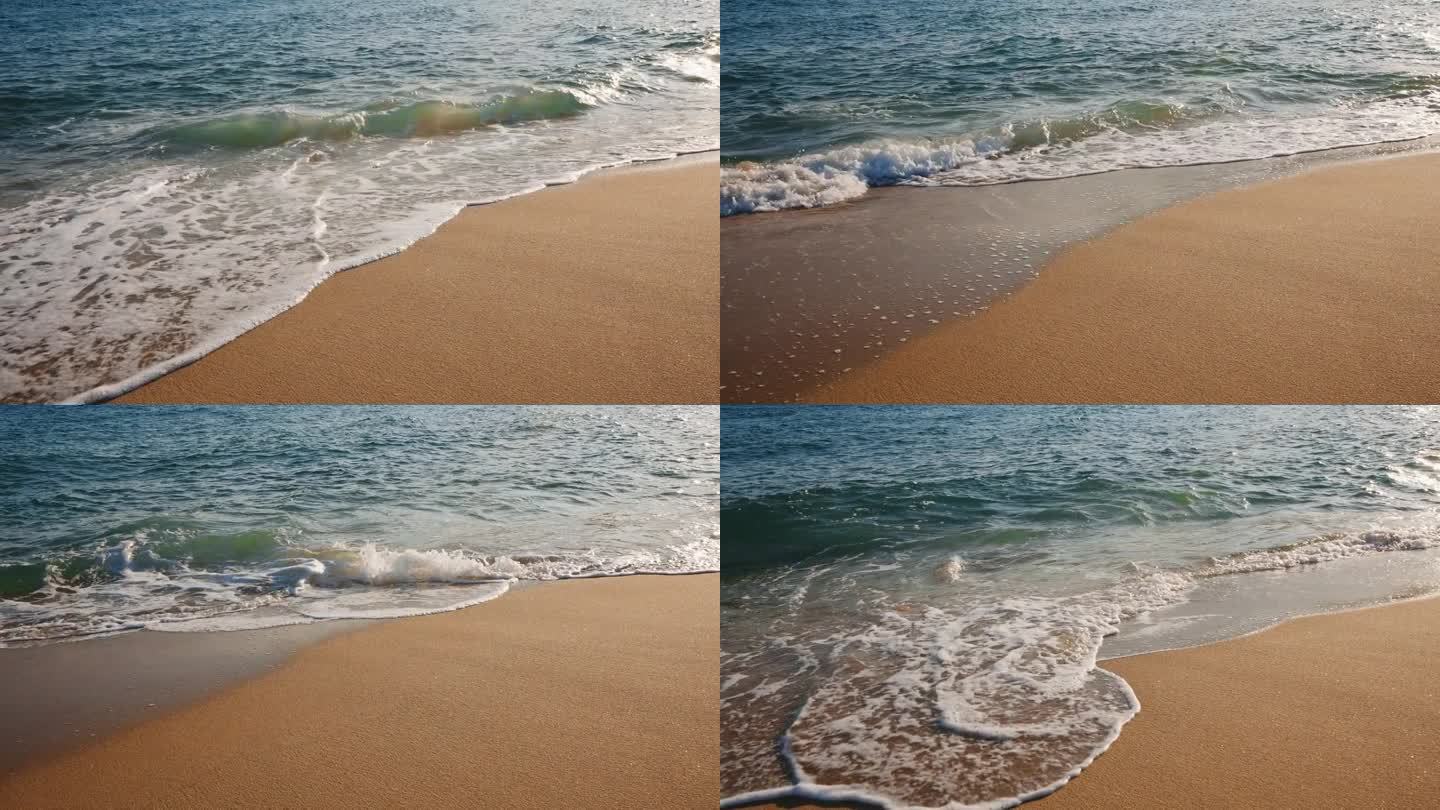 质地移动海浪的海水在金色沙滩岸边夏天的慢动作。海岸。明亮的金色沙子。小浪拍打着沙滩。海洋膨胀。自然