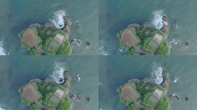 无人机在印度尼西亚巴厘岛乌鲁瓦图的热带巴兰干海滩半岛上拍摄，海浪和绿松石般的海水