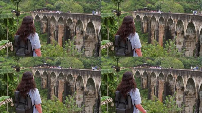 一位女游客正在观看斯里兰卡著名的九拱桥