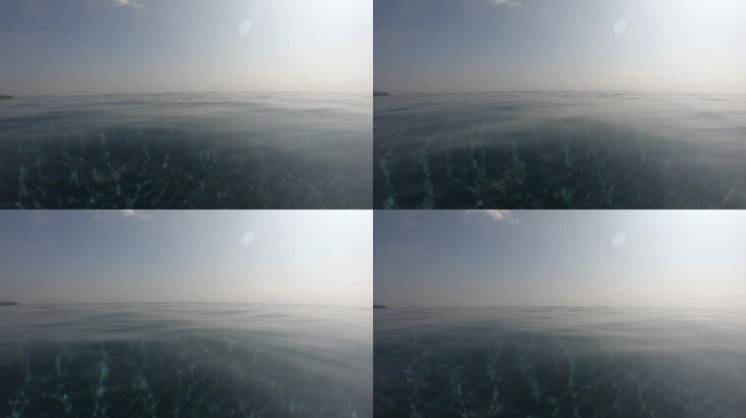 夏季室外游泳池的水波面，天空中有云的运动场景