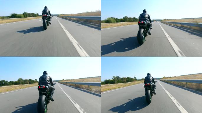 跟随摩托车手在高速公路上骑着现代运动摩托车。骑摩托车的人在乡间公路上驾驶摩托车。旅途中骑自行车的人。