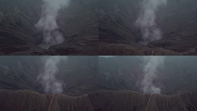 无人机鸟瞰图:布罗莫火山火山口边缘与蒸汽，亚洲。旅游目的地探险自然的概念