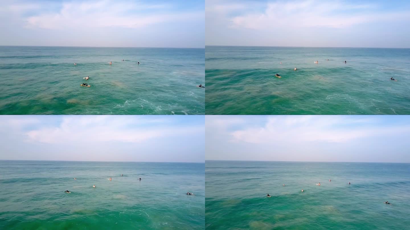 一群海外游客试图在暴风雨中冲浪