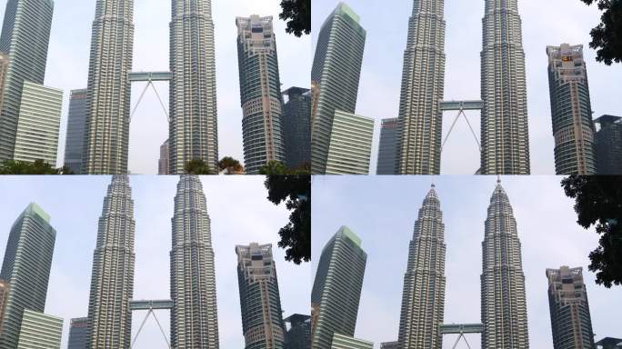 双子塔，马来西亚吉隆坡的重要标志，在建筑周围美丽的景观，在上午。