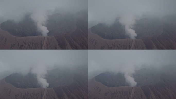 无人机鸟瞰图:布罗莫火山火山口边缘与蒸汽，亚洲。旅游目的地探险自然的概念