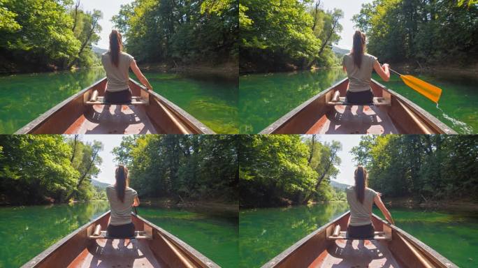 在水上玩得很开心，一个女人划着独木舟