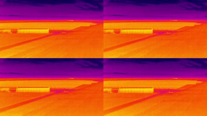 大型光伏农场太阳能发电厂的航空红外热视图，紫色和黄色色调