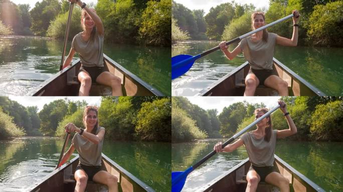 年轻女性享受假期，划着独木舟