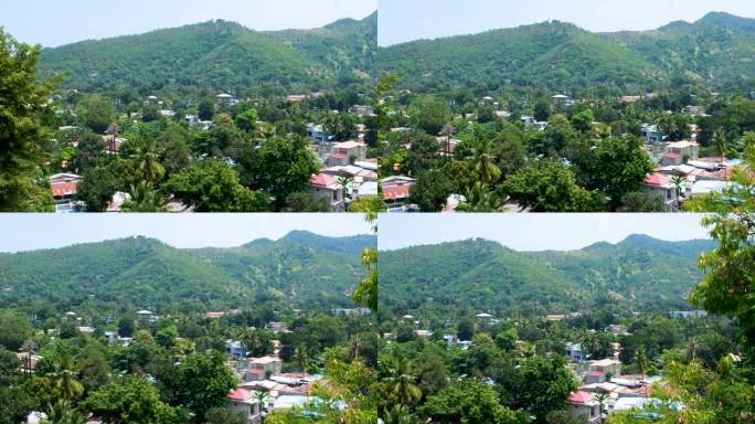 位于东南亚东帝汶首都帝力的当地社区住宅坐落在绿树和山丘之间，风景优美