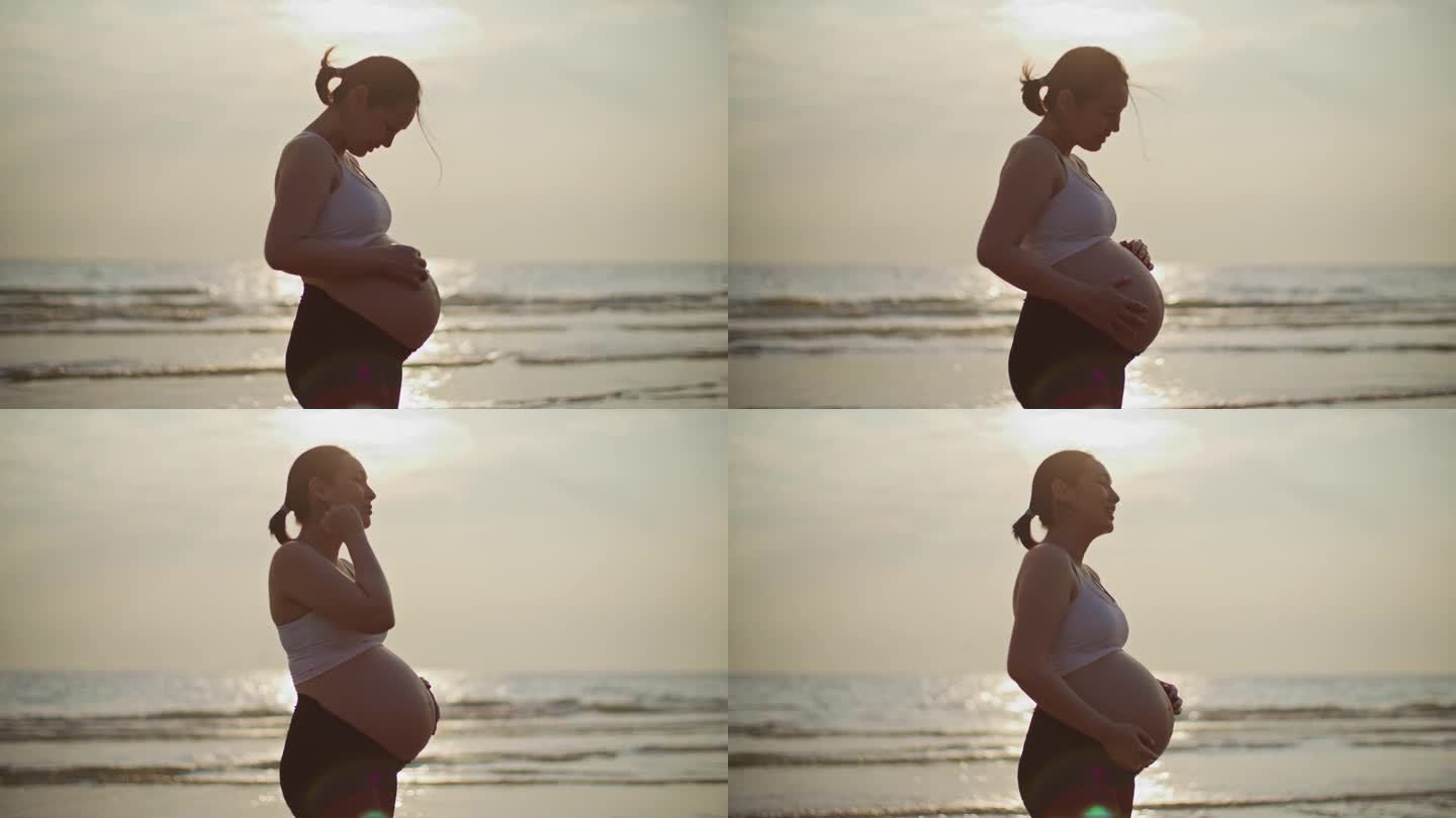 海滩上的孕妇早晨阳光照射海面孕妇呼吸