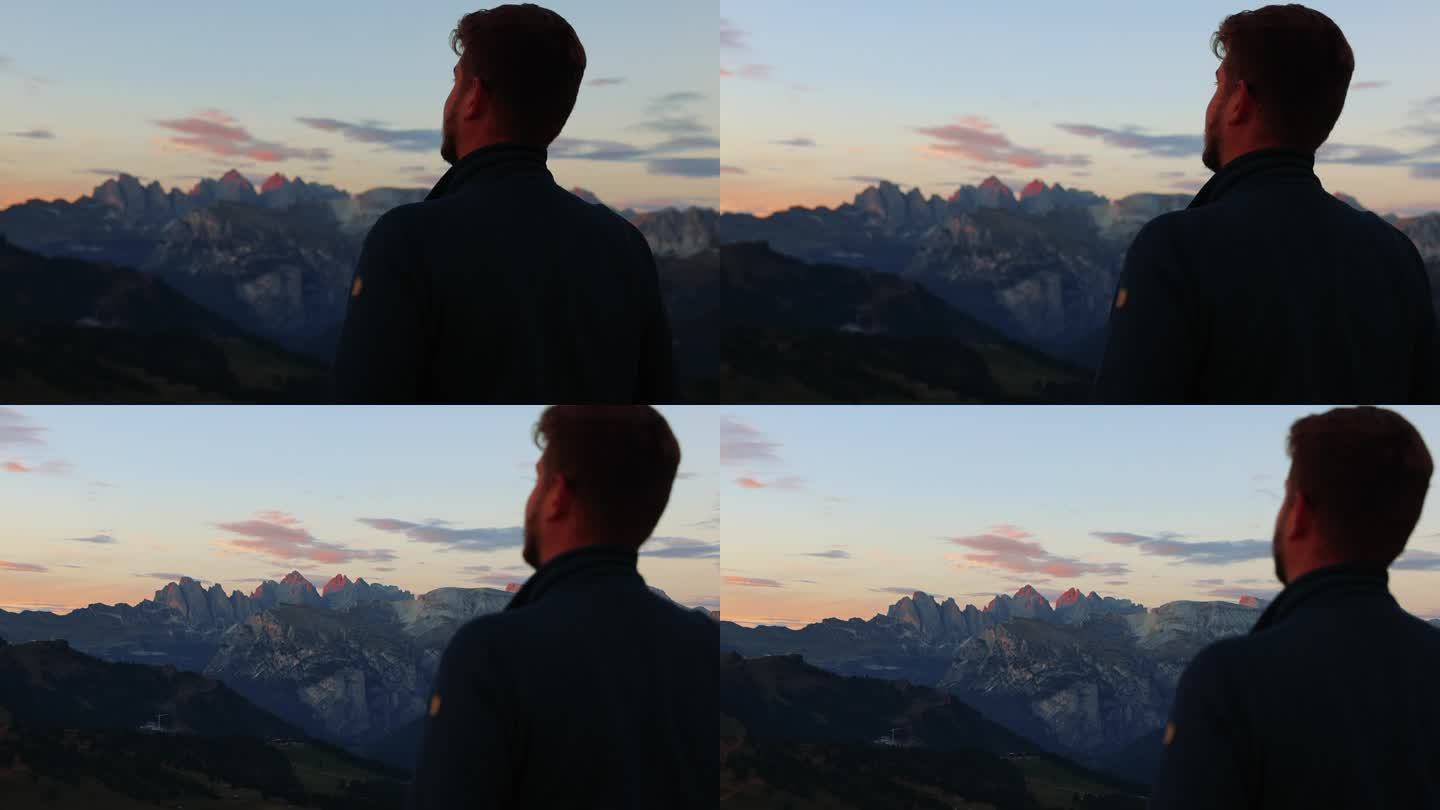 在美丽的山峰上眺望田园诗般的日出的剪影