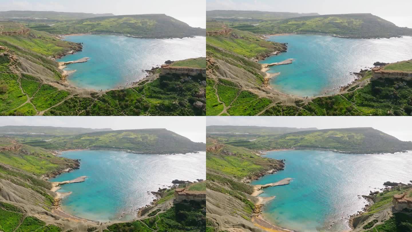 著名的马耳他湾的无人机视图。春天，绿色的乡村。马耳他岛