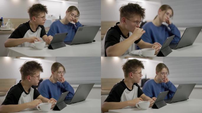 青少年在家里使用笔记本电脑和桌子