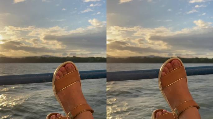 前景是一个女人的脚，在尼加拉瓜的科奇博尔卡湖上航行