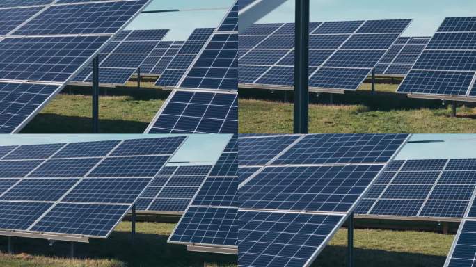 太阳能公园里的光伏太阳能电池板。绿色的草地和蓝天上的太阳能电池板。
