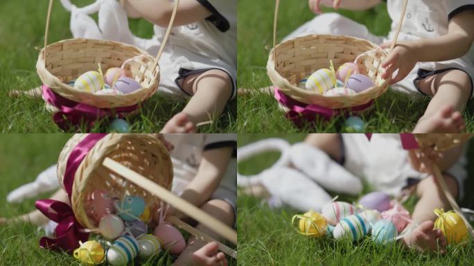 复活节快乐庆祝:特写镜头婴儿双手翻动篮子复活节彩蛋
