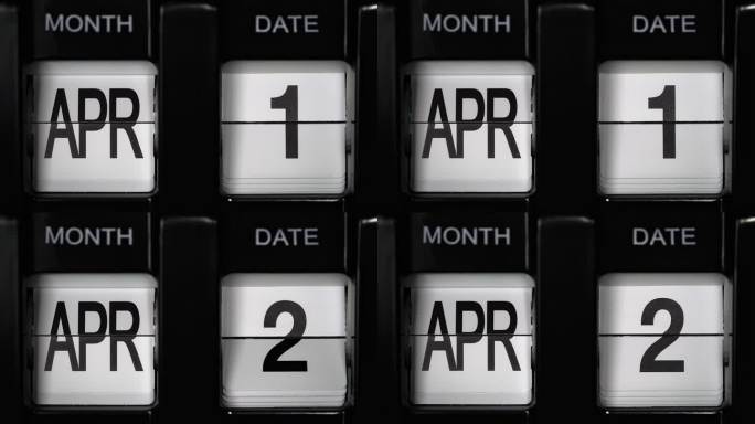 日历翻转与日期更改4月1日至4月2日。每日日历与变化的日子月。