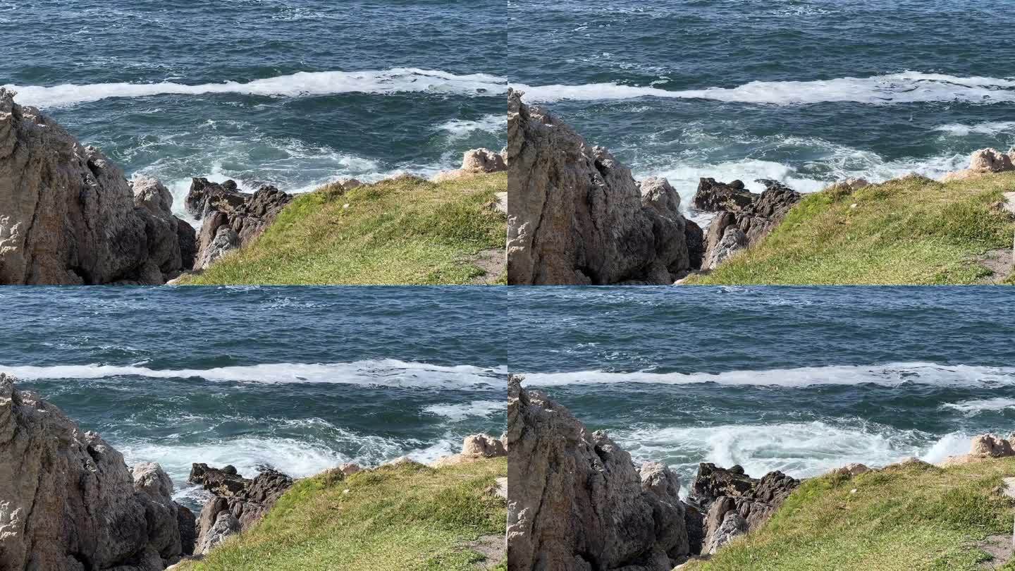 岩石海岸的海景与白色的海浪从高cl