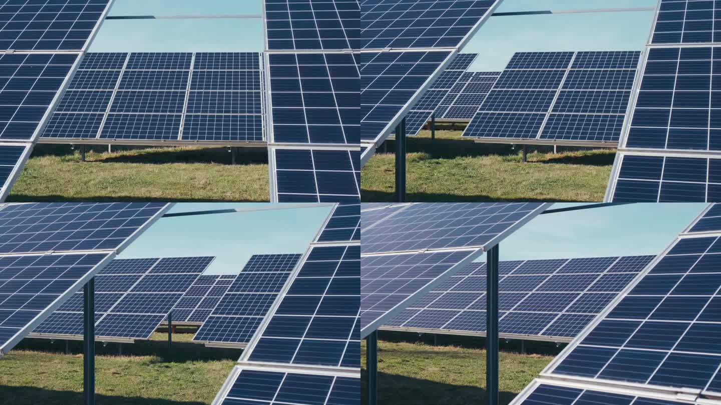 太阳能公园里的光伏太阳能电池板。绿色的草地和蓝天上的太阳能电池板。