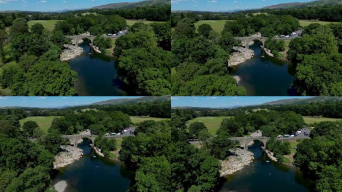 4K:英国英格兰坎布里亚郡柯克比朗斯代尔恶魔桥的空中无人机视频。对飞行。库存视频剪辑素材