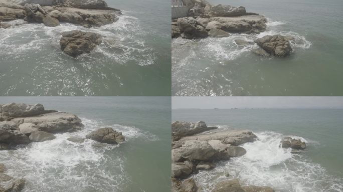 岸边海浪拍打岩石