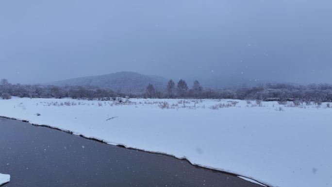 4K航拍不冻河下大雪视频24328(1)