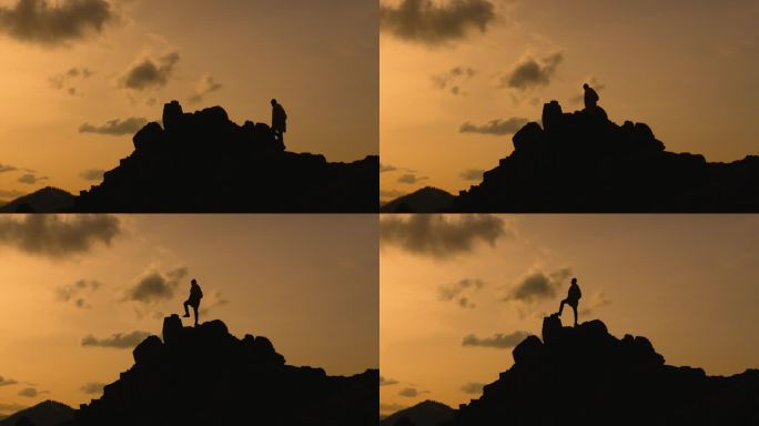 到达顶峰和新高度的氛围。徒步旅行者或游客爬上高高的岩石悬崖的剪影，到达山顶，欣赏美丽的日落天空