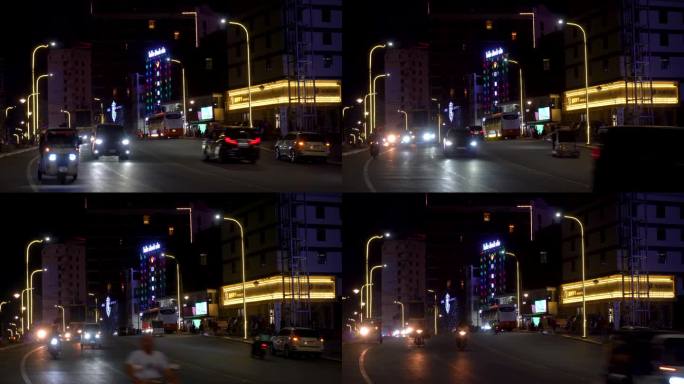 柬埔寨西哈努克城的街道。建筑，人，交通。夜城的景色，灯光和灯饰的海洋