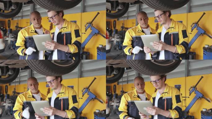 汽车修理店的两个机械师正在讨论如何修理一辆旧车的底盘和悬挂系统