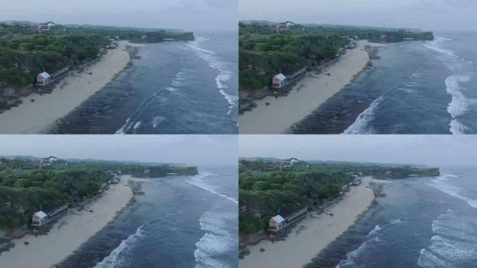 无人机在印度尼西亚巴厘岛乌鲁瓦图的热带巴兰干海滩上空飞行，海浪破碎