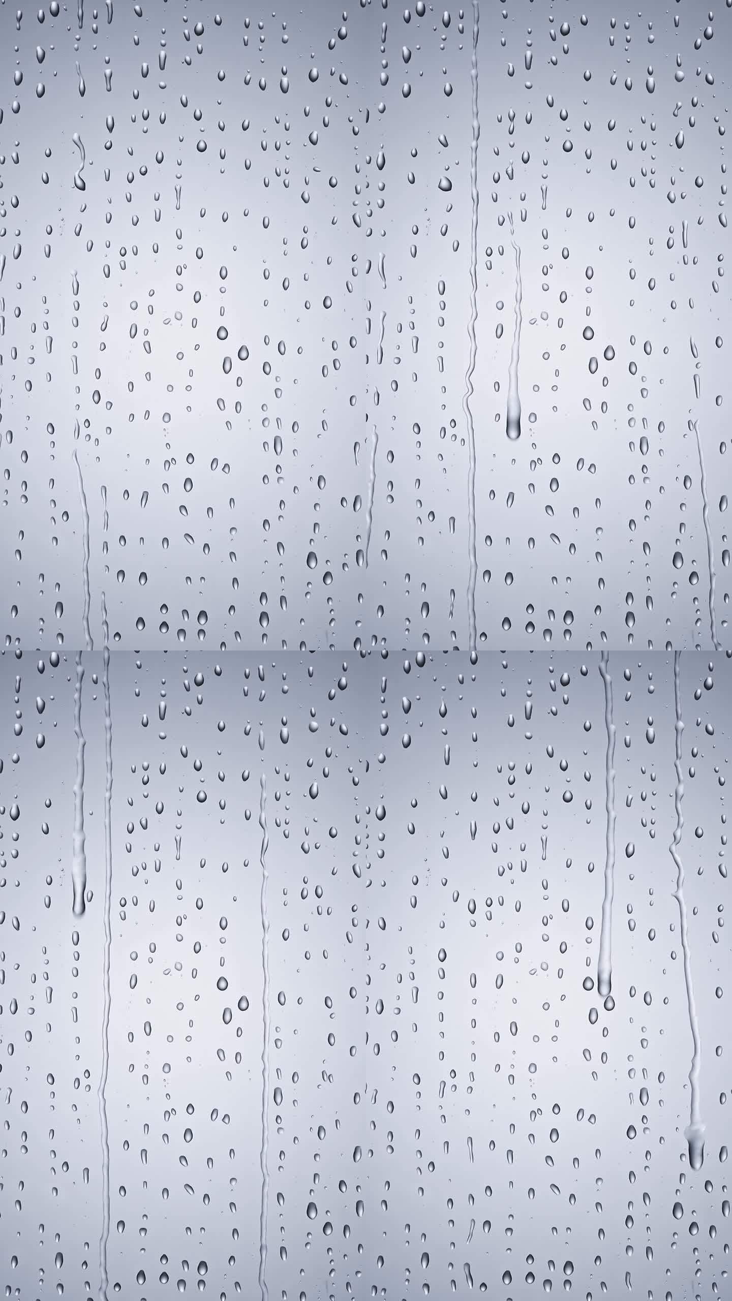 下雨天玻璃上的水珠水滴流下