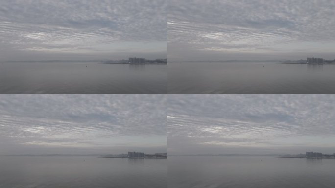 山东省威海市威海湾日出晨光天空云朵